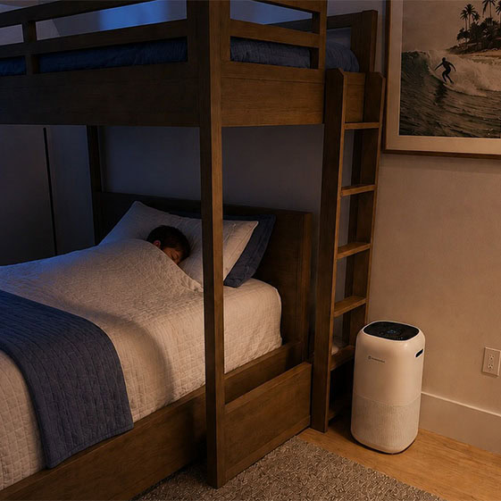 TrustedAir TruFlow smart HEPA air purifier placed beside a bunk bed in a cozy bedroom, providing clean air for a healthy sleeping environment.