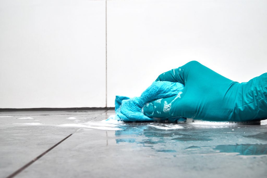 scrubbing bathroom floor