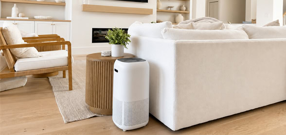 Modern smart HEPA air purifier in a stylish living room for clean indoor air quality.
