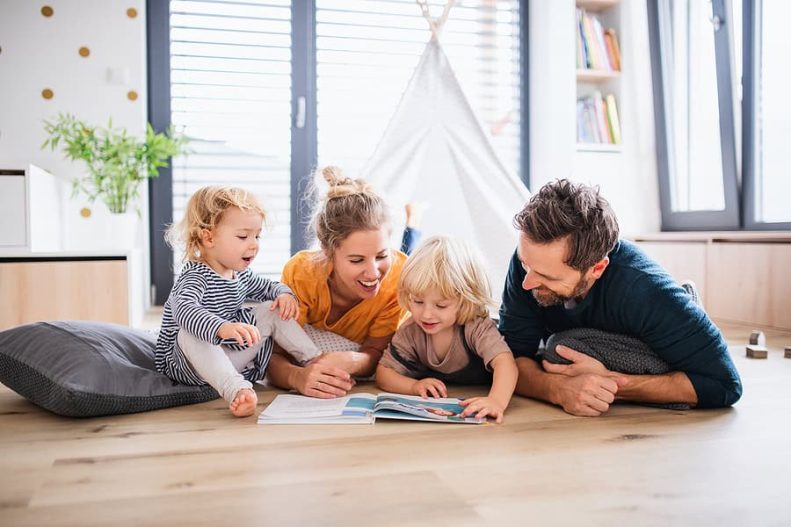 Family on the ground in their home breathing clean air